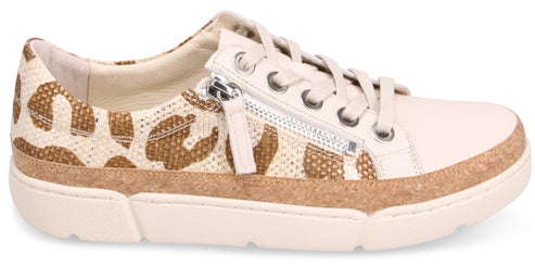 A sneaker with a white toe, a side zipper, laces, and a tan and white patterned heel.