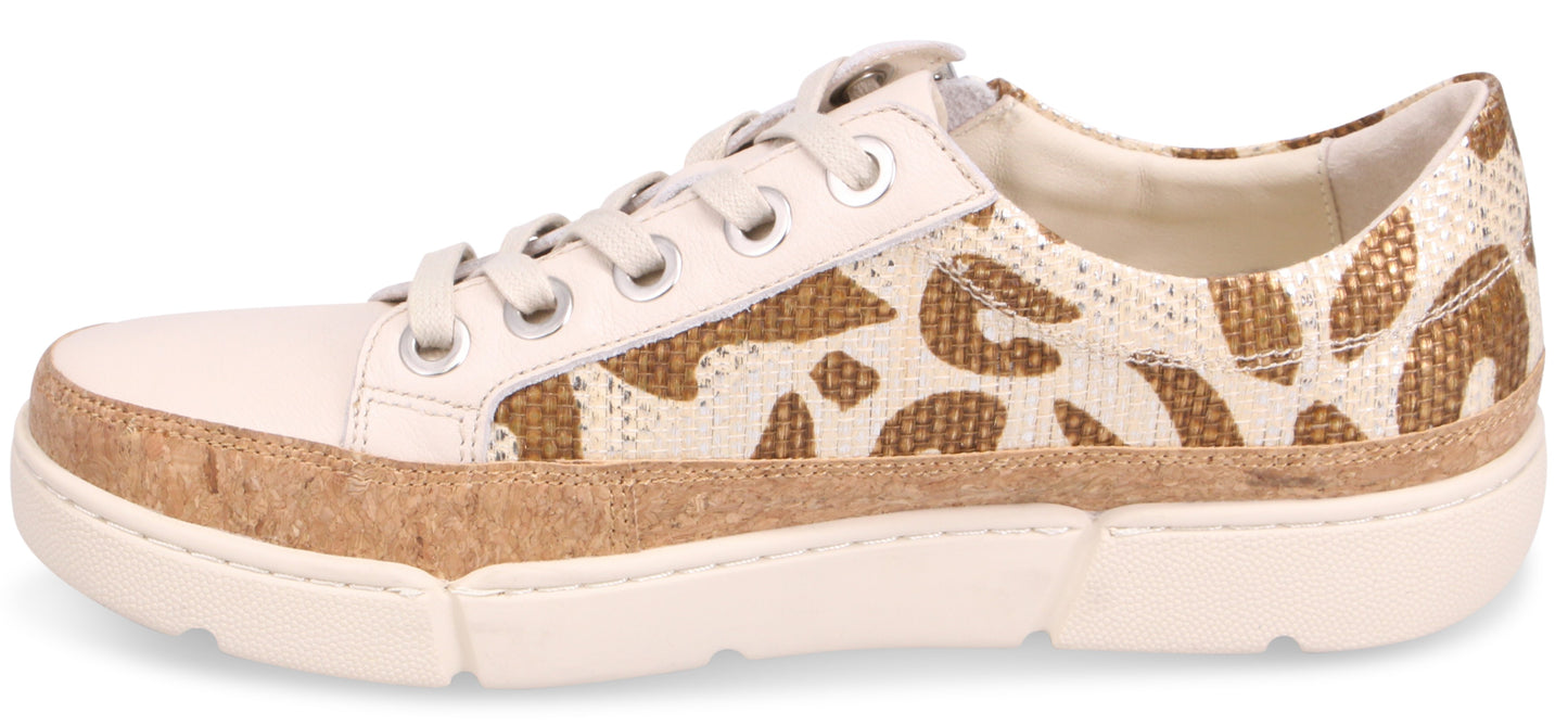 Side view of a low-top sneaker with white leather toe and laces and brown and white textile animal-print side.