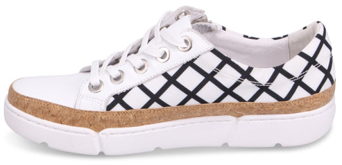 White sneaker with black geometric pattern and cork trim.