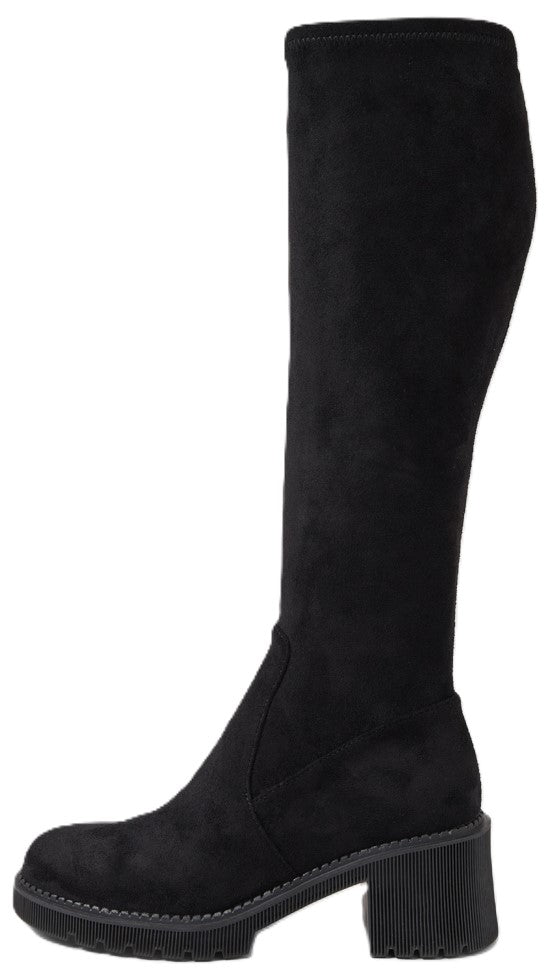 A black suede knee-high boot with a thick block heel and lugged platform sole.