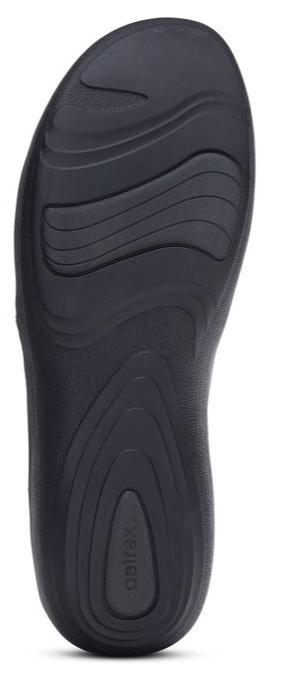 Insole with arch support and a textured surface.
