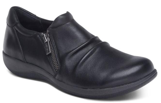 Black leather slip-on shoe with side zipper and rounded toe.