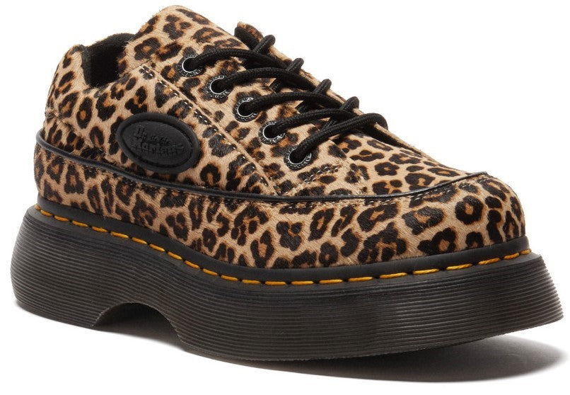 Leopard-print platform shoe with black laces and a black sole.
