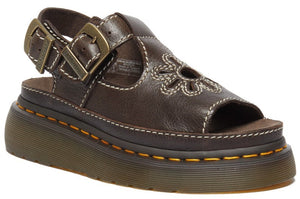 Brown leather platform sandal with open toe, flower cutout, buckled slingback strap, and contrast stitching.