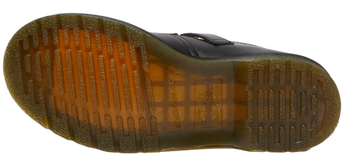 The underside of a shoe revealing a grooved sole.