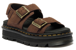 Brown suede sandals with black platform sole and brass buckles.