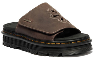 Platform sandal with a wide brown velcro strap featuring flower cutouts and white stitching.