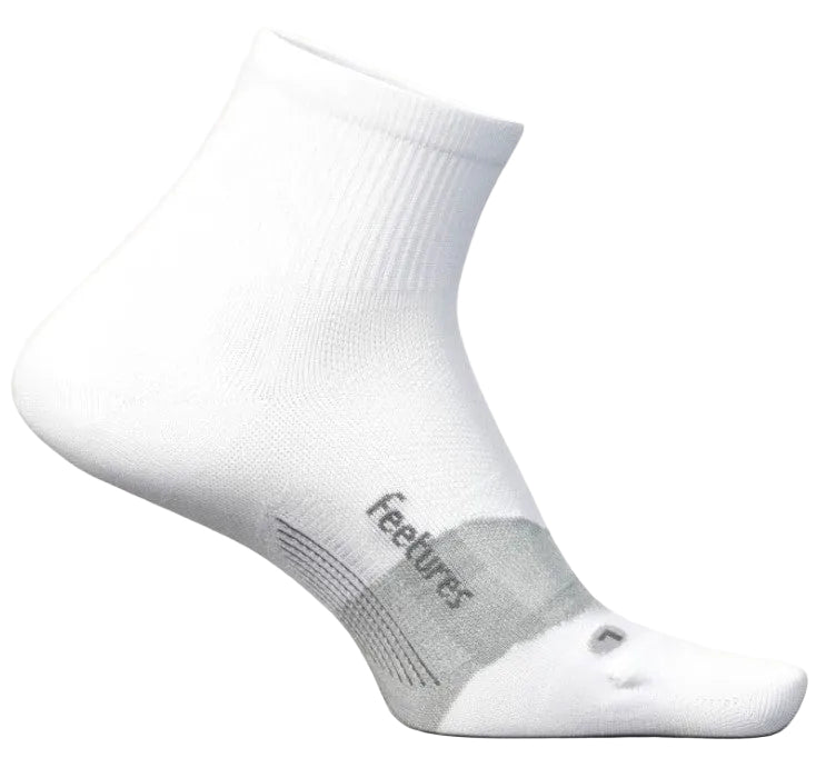 A white quarter-length athletic sock with a gray arch support band labeled 'feetures' and a small gray accent mark on the toe, shown from a side profile view.