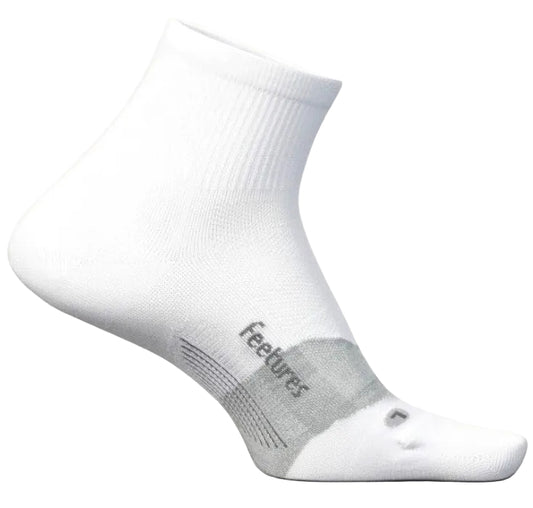 A white quarter-length athletic sock with a gray arch support band labeled 'feetures' and a small gray accent mark on the toe, shown from a side profile view.