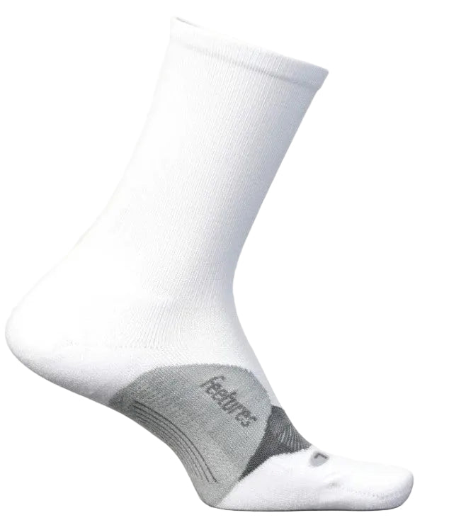 A white crew-length athletic sock with a grey arch support panel featuring the word Feetures written on the side.
