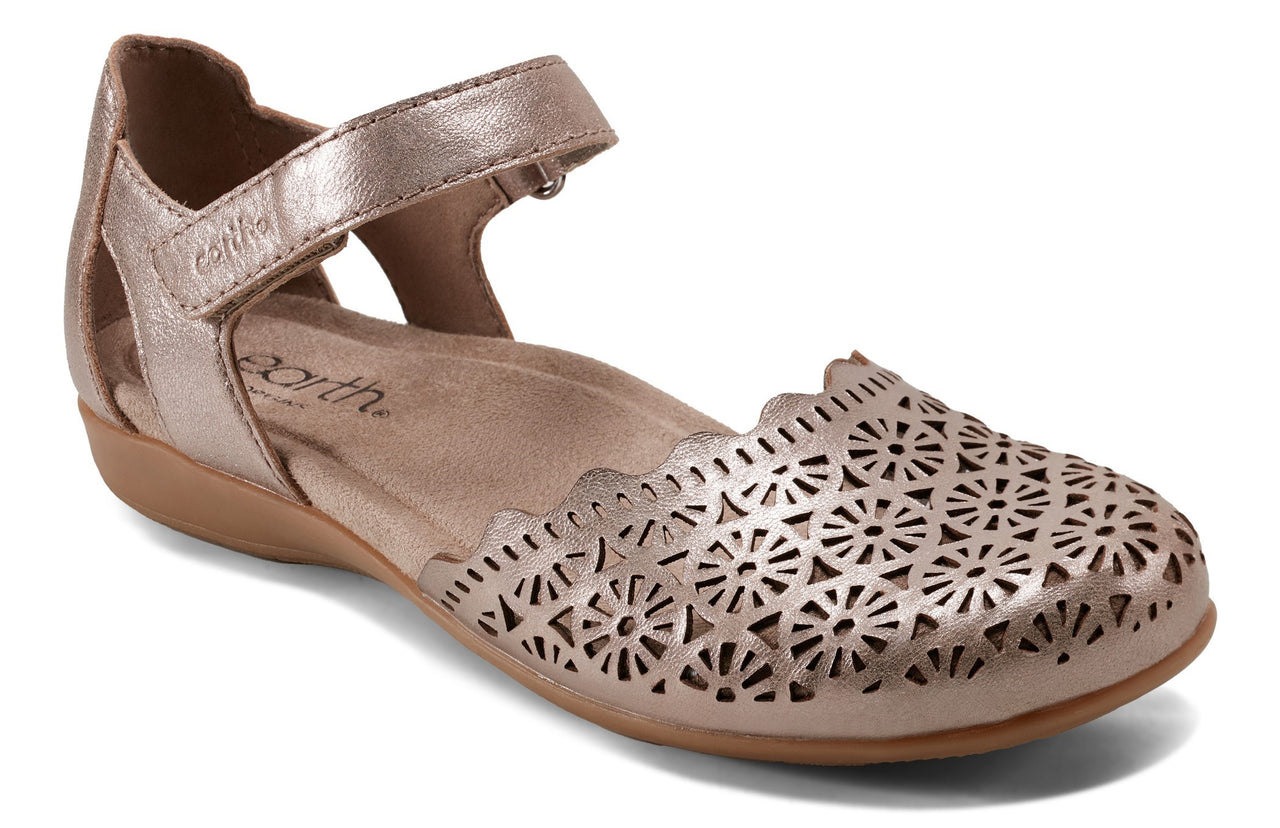 Rose-gold flat with ankle strap and laser-cut floral pattern on toe.