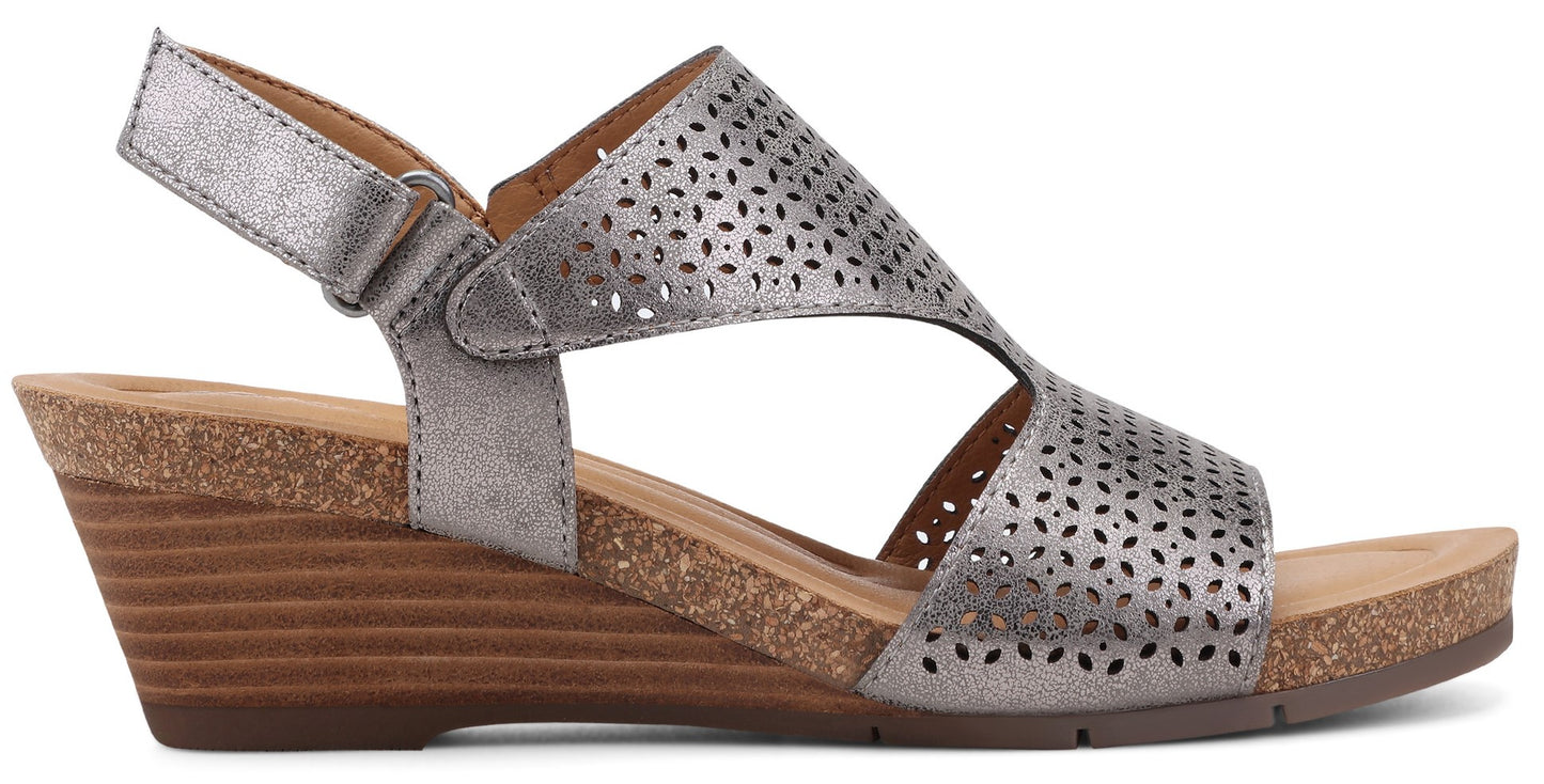Wedge sandal with laser-cut leather upper, adjustable ankle strap.