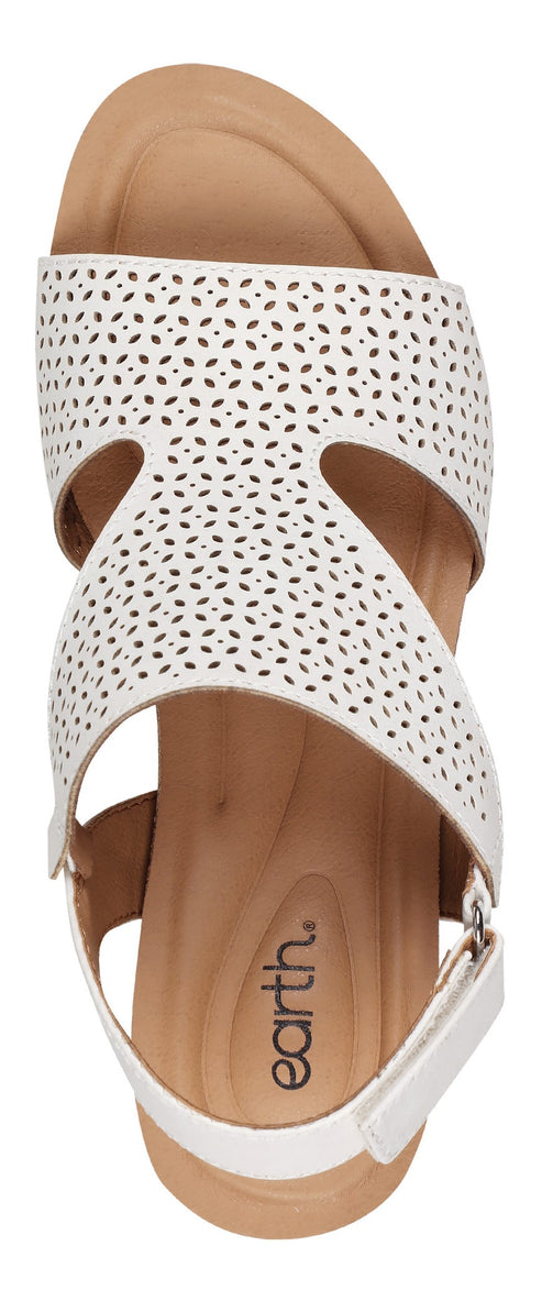 A white Earth sandal with decorative cutout details.