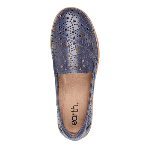 Overhead view of a blue leather slip-on shoe with geometric laser cutouts and the word "earth." on the shoe's interior.