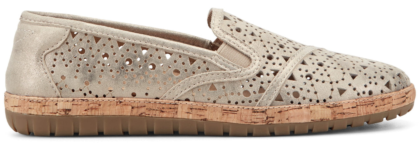 A gold-colored slip-on shoe with decorative cutouts and a cork midsole.