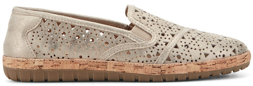 A gold-colored slip-on shoe with decorative cutouts and a cork midsole.