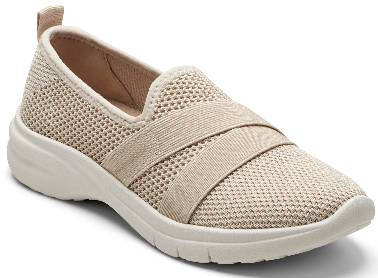 Beige slip-on shoe with elastic strap and mesh upper.