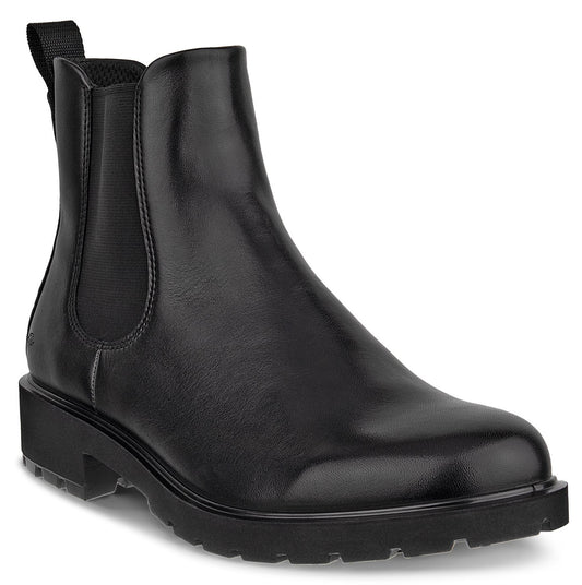 A black leather Chelsea boot with elastic side panels, a pull tab at the back, and a thick, lugged rubber sole, shown in a side profile view.