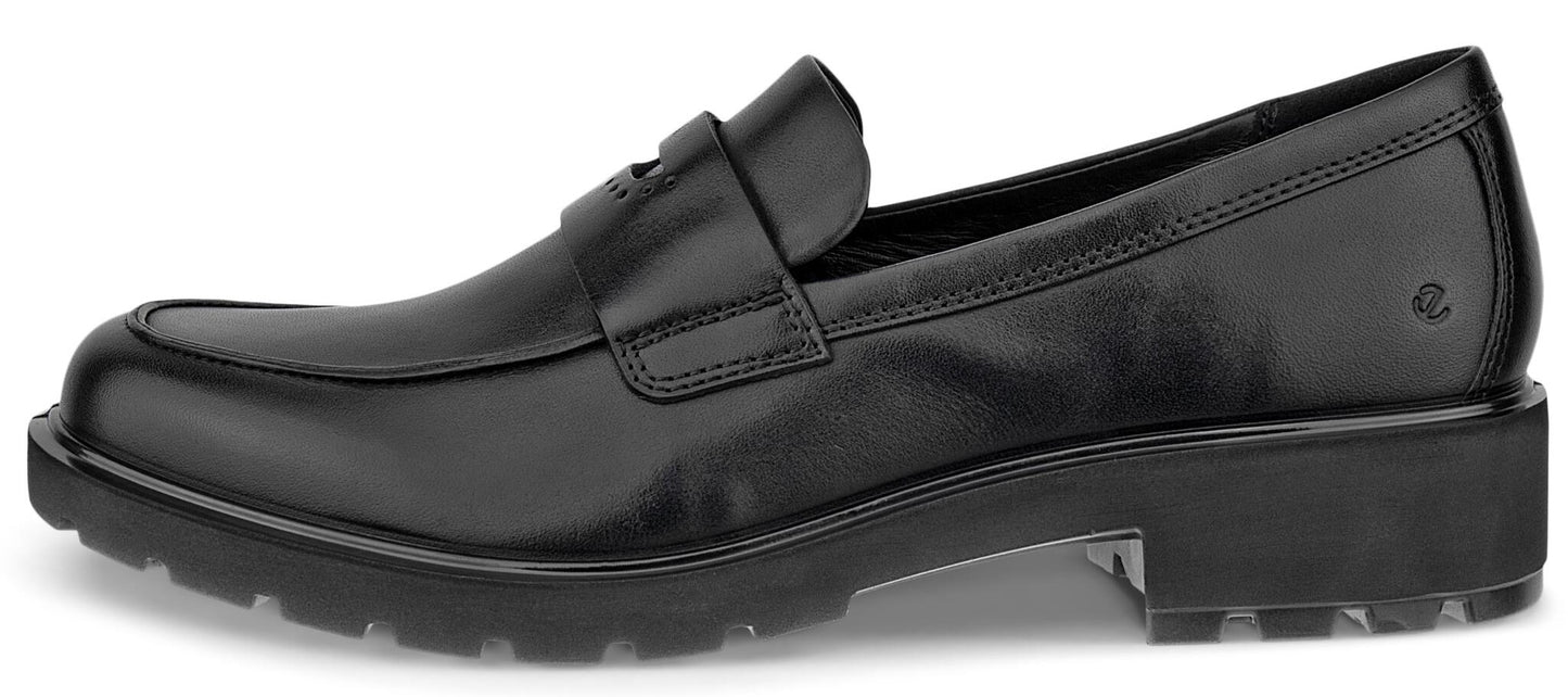 A black leather penny loafer shoe shown from the side profile, featuring a thick, cleated lug sole and a classic slip-on design with a saddle strap across the upper.