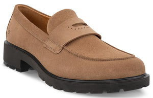 A tan suede loafer with a chunky black lug sole, featuring a strap across the vamp with decorative perforations.