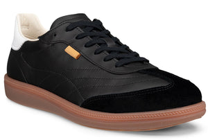 Black sneaker with suede toe, gum sole, and white heel.