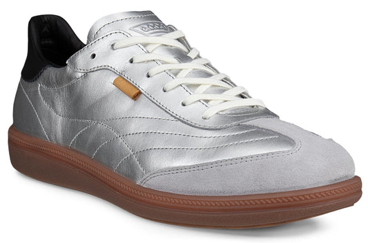 Silver sneaker with white laces, gray suede toe, and brown sole.