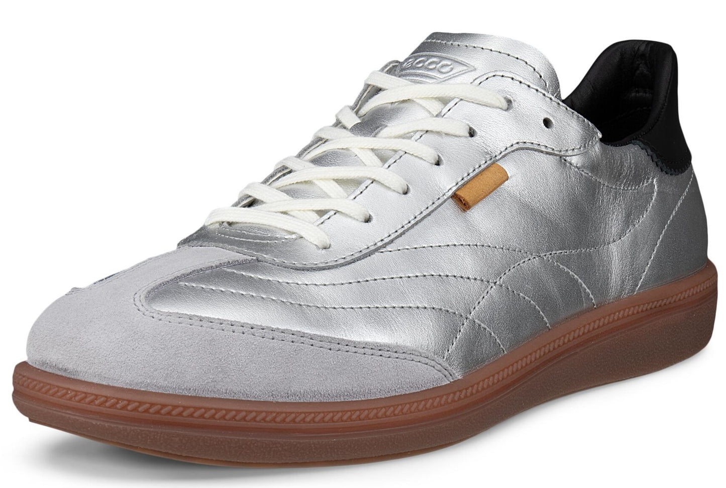 Silver sneaker with suede toe, brown sole, white laces and a black heel.