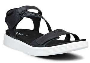 A black sandal with a white sole and a t-strap design.