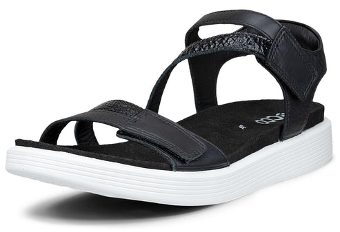 Black sandal with velcro straps and white sole.