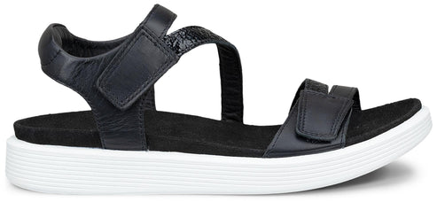 A black sandal with hook and loop fasteners and a white platform sole.