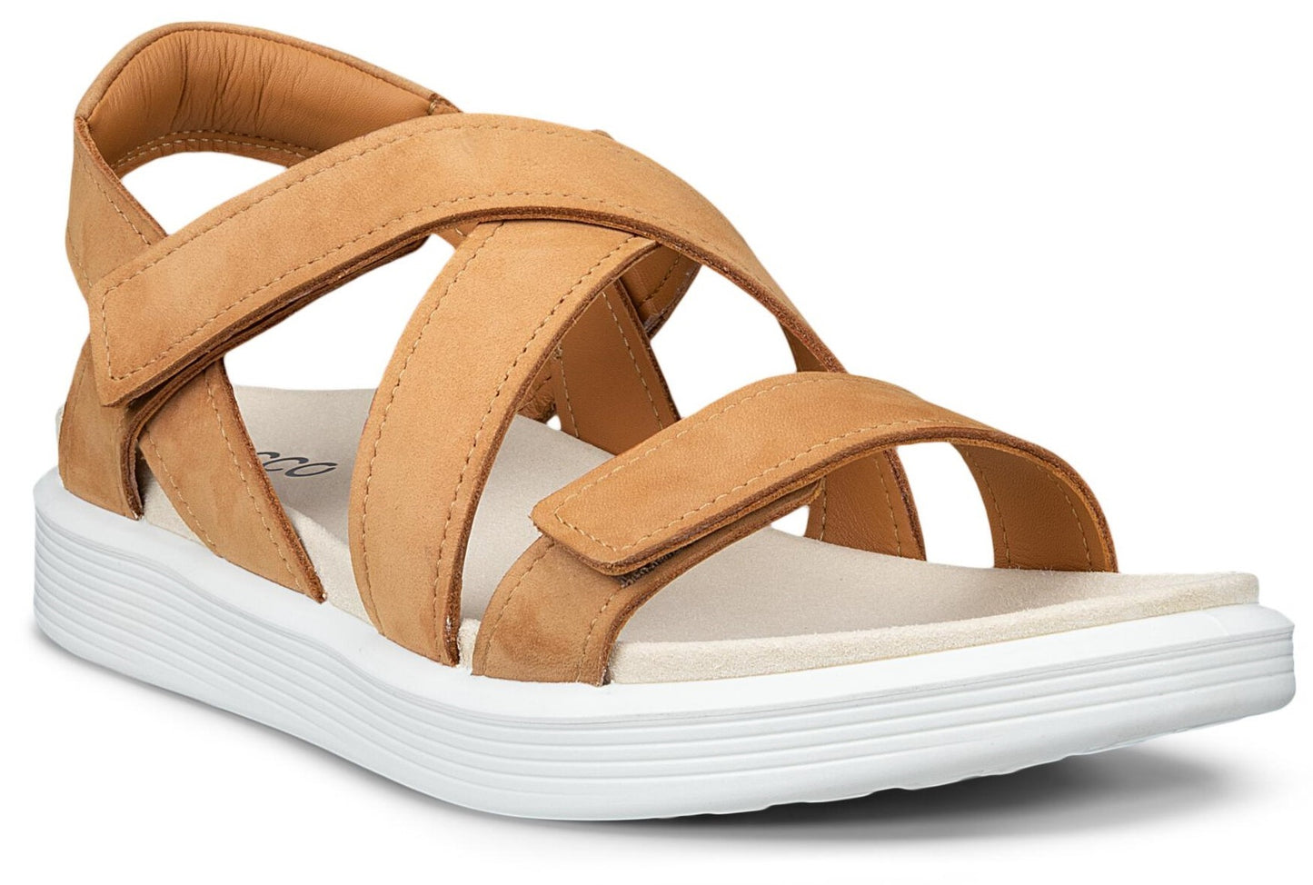Tan sandal with criss-cross straps and white sole.