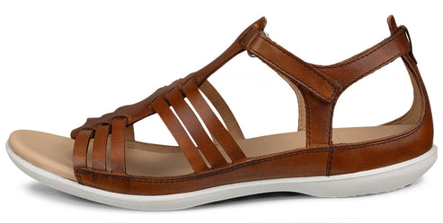 Brown leather sandal with interwoven straps, white sole, and adjustable ankle strap.