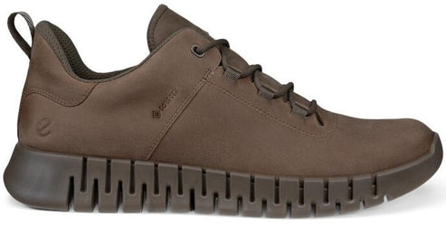 Low-profile brown shoe with a textured sole.