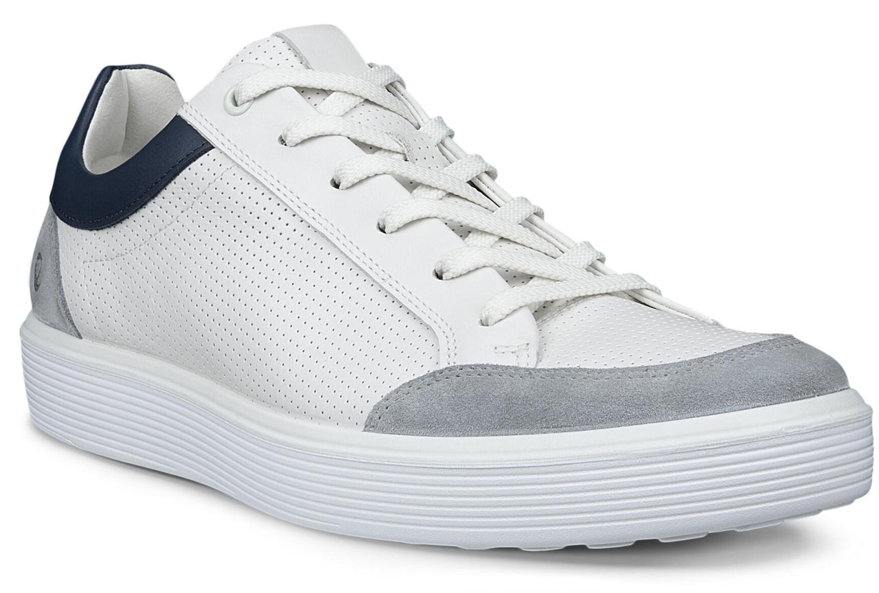 A white perforated leather sneaker with grey suede accents and a navy heel.