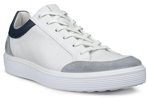 A white perforated leather sneaker with grey suede accents and a navy heel.
