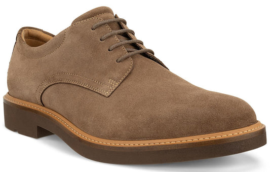 A tan suede dress shoe with brown laces and a stacked sole.