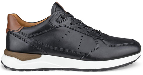 A black leather low-top sneaker with a brown leather accent at the heel, black laces, a thick white midsole, and a black treaded outsole.