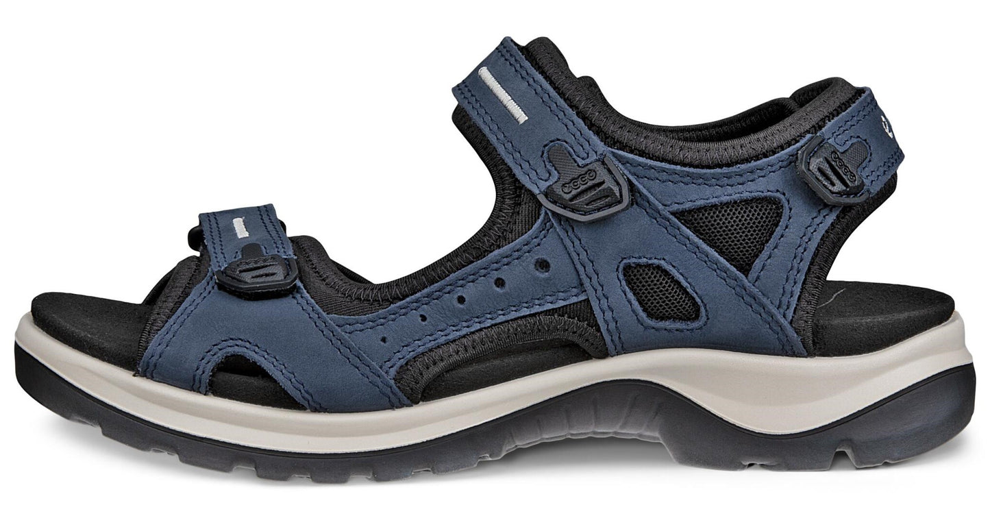 Blue sandal with velcro straps and a thick white and black sole.
