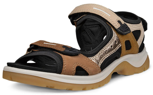 Sport sandal with beige, brown, and black straps and thick sole.