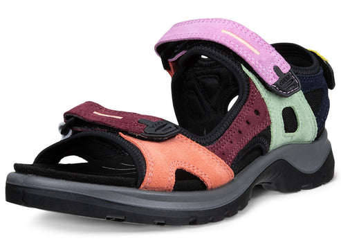 Multi-colored sandal with adjustable velcro straps on a thick, black and gray sole.