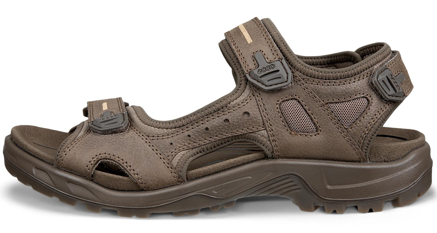 Brown leather sandal with hook and loop closures.