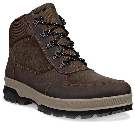 A brown leather and mesh hiking boot with a beige midsole and a black lugged rubber outsole, featuring black and white patterned laces through metal D-ring eyelets.