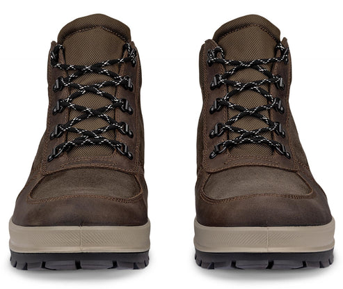 A pair of brown leather hiking boots with laces and thick, light-colored soles shown from the front.