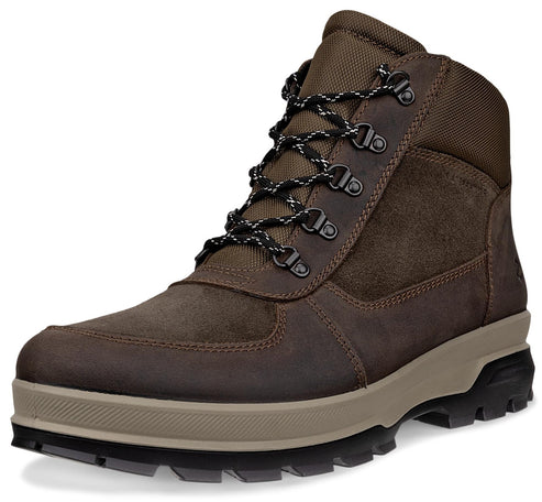 A brown men's outdoor ankle boot with mixed suede and textile panels, a tan thick rubber midsole, and a black lugged outsole with dark-patterned lace-up closure.