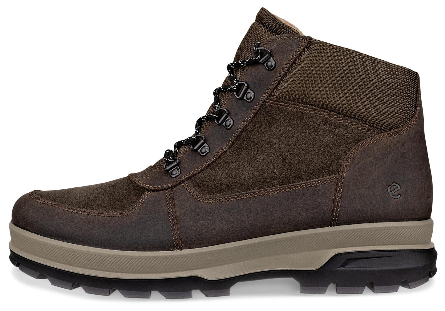 A brown leather and suede hiking boot featuring a lace-up front, a multi-layered tan and black lugged rubber sole, and an embossed circular logo near the heel.