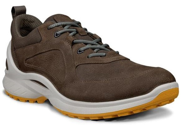 Brown athletic shoe with white sole and gray laces.
