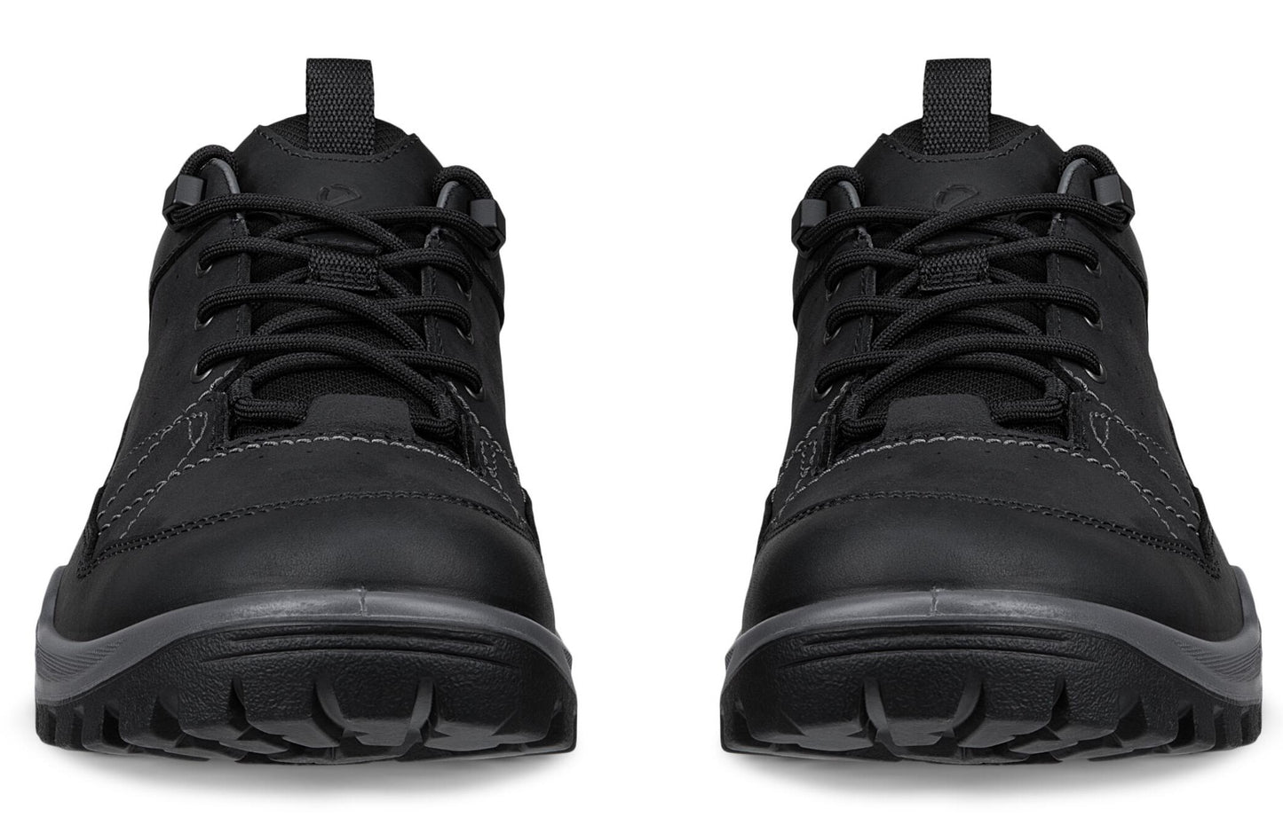 A pair of black, lace-up outdoor shoes with textured outsoles viewed from the front, showcasing their rounded toes and padded tongues.