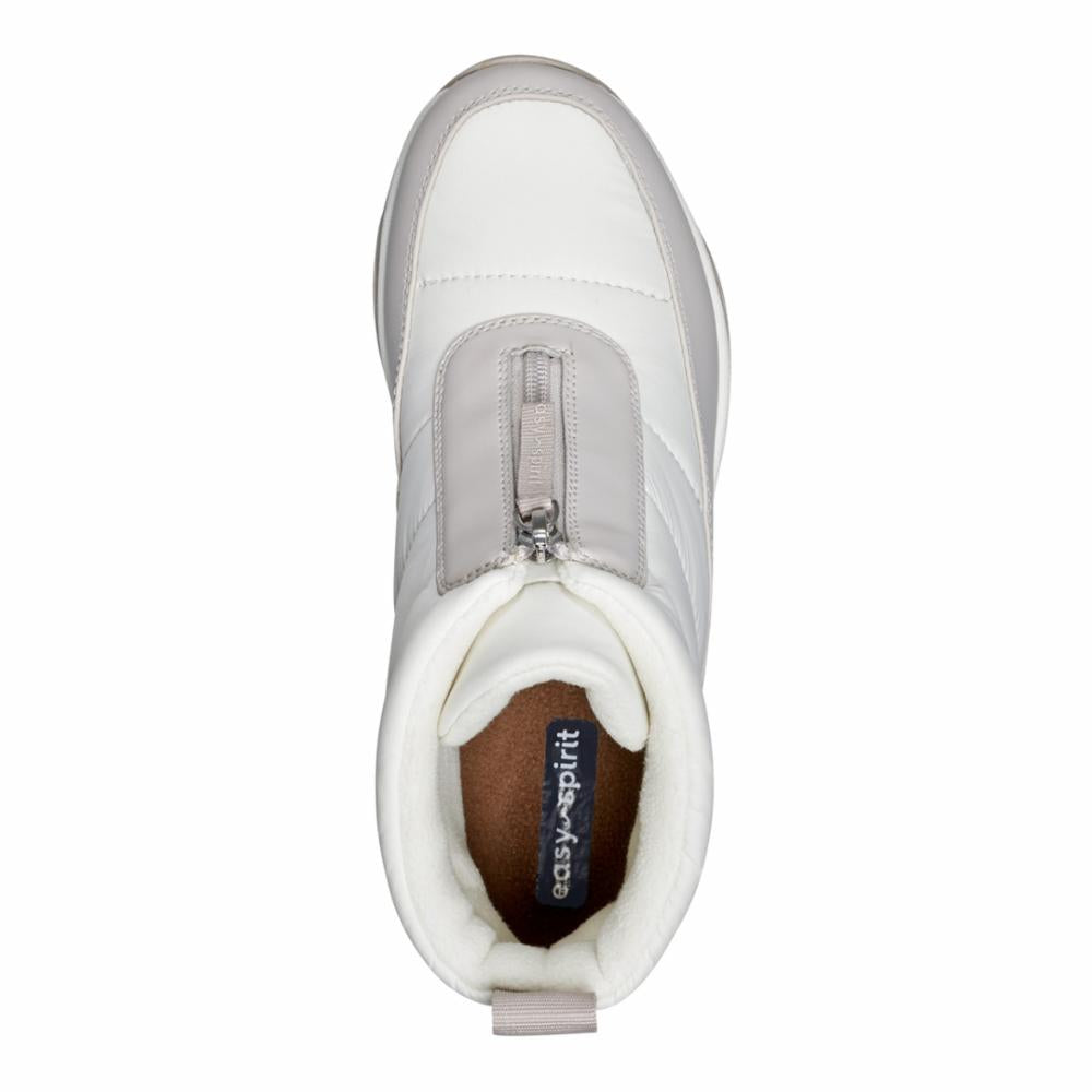 Top-down shot of a white snow boot with a grey vertical zipper and the text 'easy-spirit' inside.