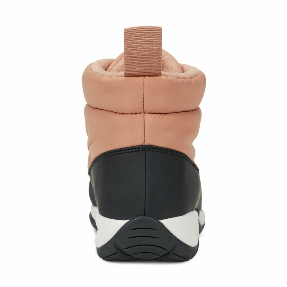 Rear view of a quilted, pale pink and black high-top shoe with a loop at the top.