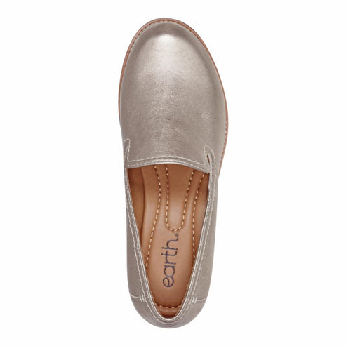 Top-down view of a gold-colored slip-on shoe with a rounded toe and a flat sole.